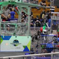 Robots pick up balls preparing to take shots